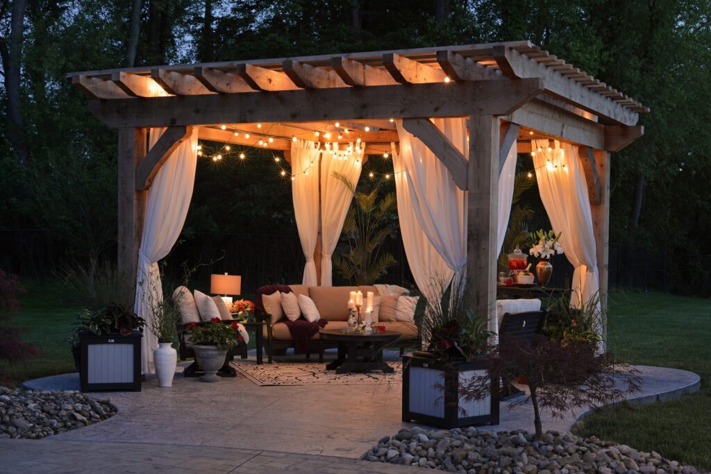wooden pergola with drapes hanging down looking beautiful